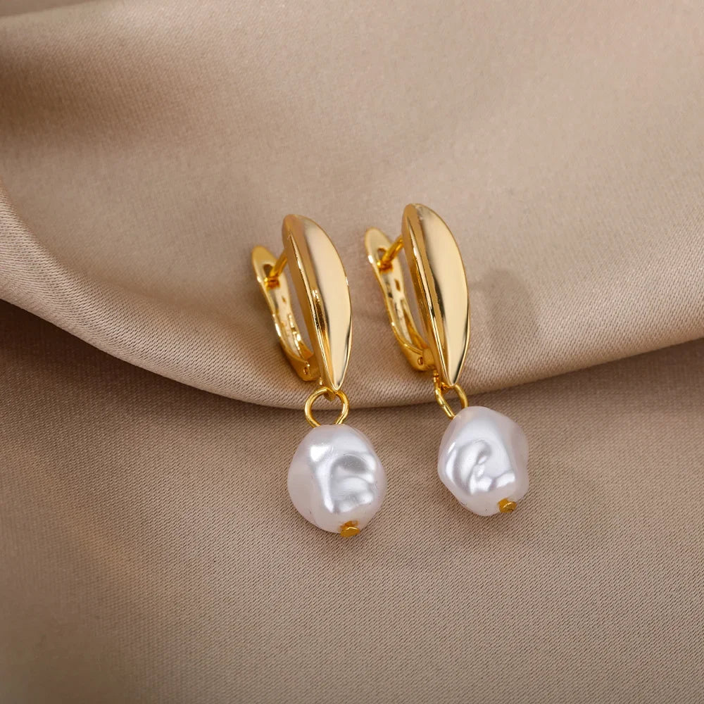 Heart hoop earrings in stainless steel with cubic zirconia heart accent, styling angle 11 - Varex HQ
