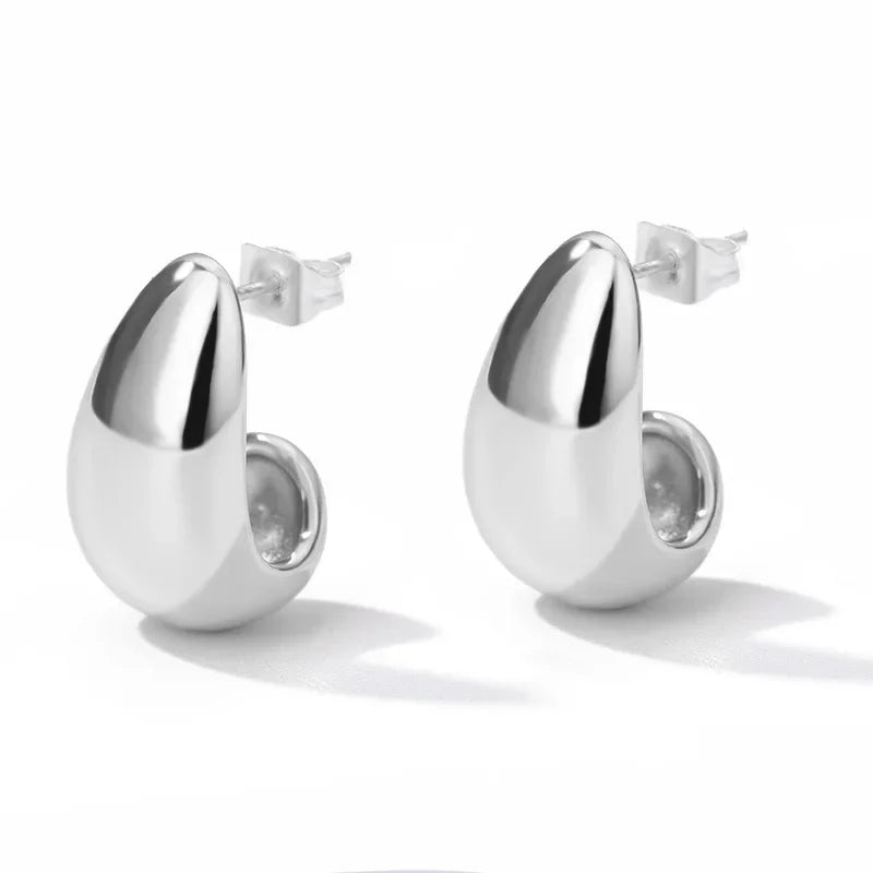 Heart hoop earrings in stainless steel with cubic zirconia heart accent, styling angle 13 - Varex HQ