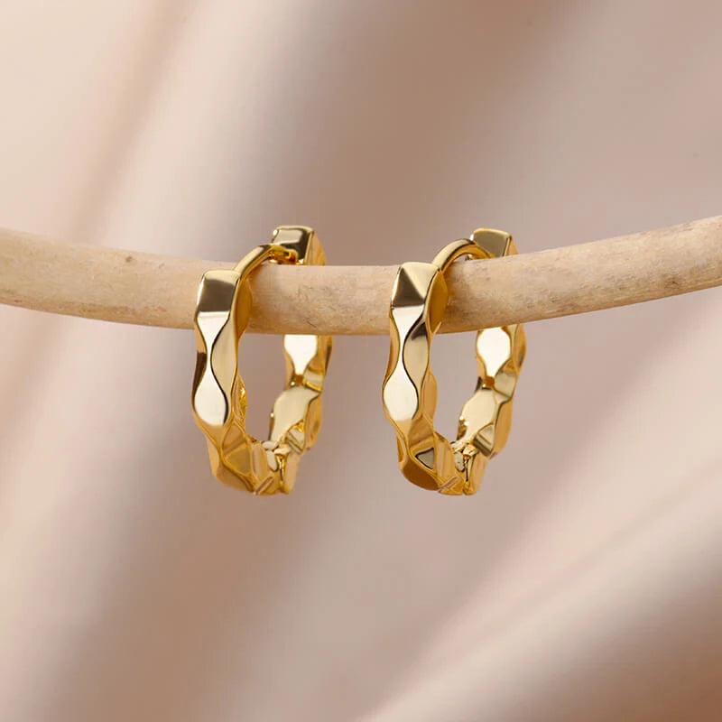 Heart hoop earrings in stainless steel with cubic zirconia heart accent, styling angle 14 - Varex HQ