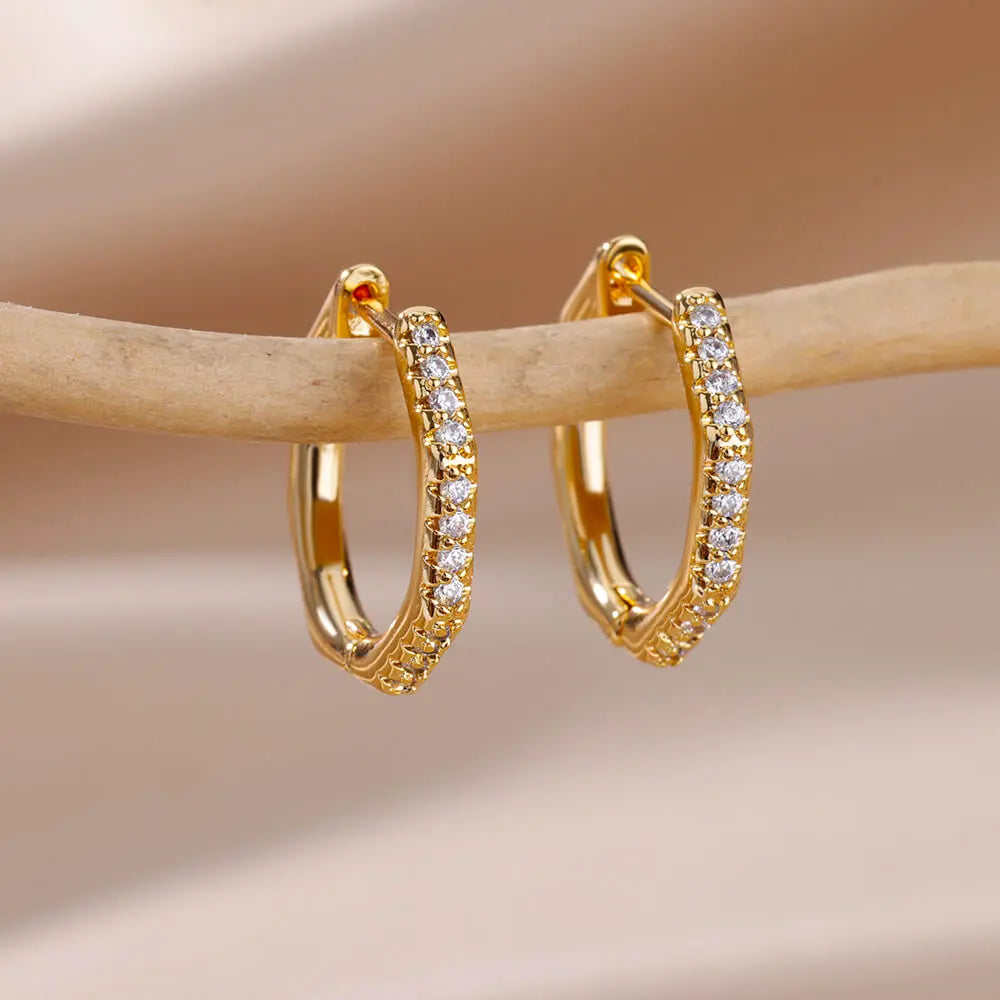 Heart hoop earrings in stainless steel with cubic zirconia heart accent, styling angle 15 - Varex HQ