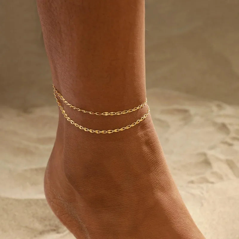 Gold-plated layered anklet and bracelet set, styled lifestyle shot, Varex HQ