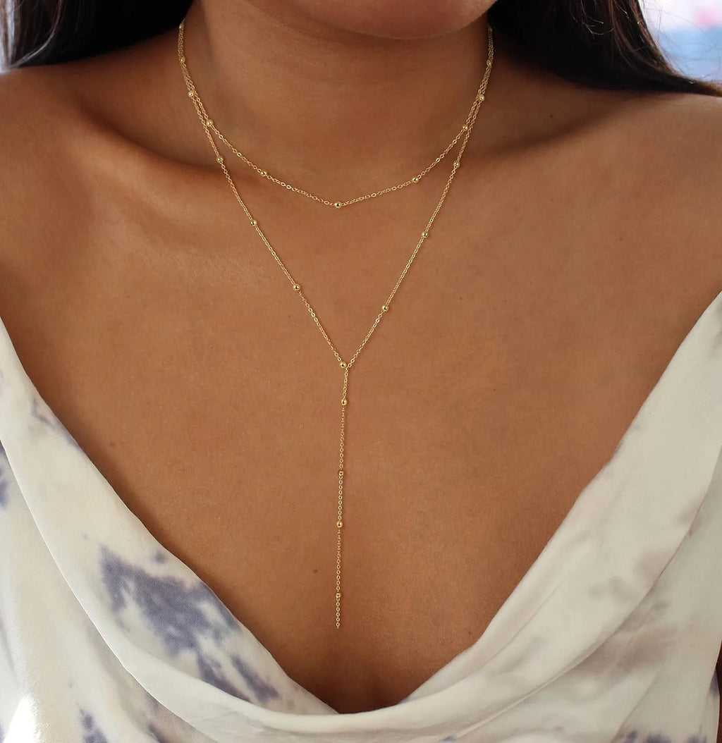 Layered Y-shape gold-plated pendant necklace with beaded chain drop - worn on the neck - Varex HQ