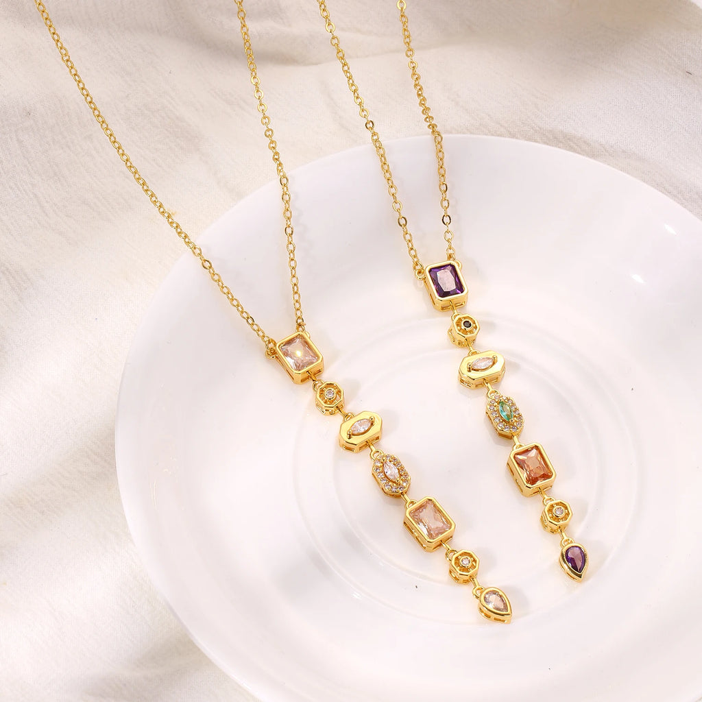 Long gold-plated pendant necklace with colored zircon drop - close-up detail - Varex HQ
