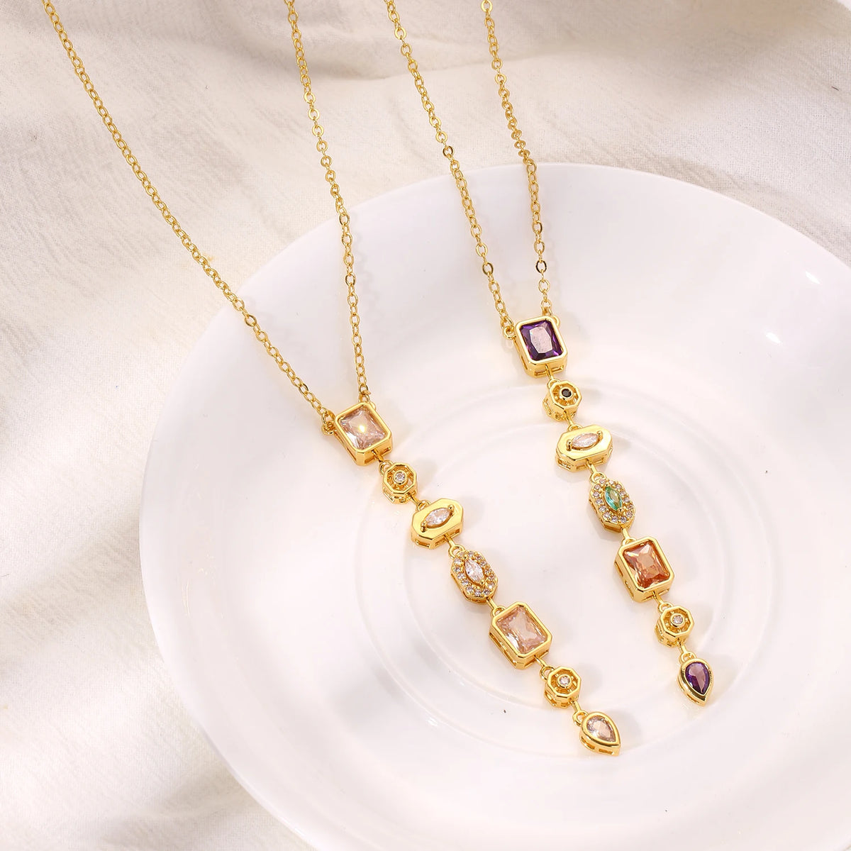 Long gold-plated pendant necklace with colored zircon drop - close-up detail - Varex HQ