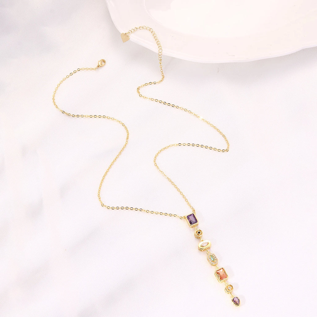 Long gold-plated pendant necklace with colored zircon drop - styling angle - Varex HQ