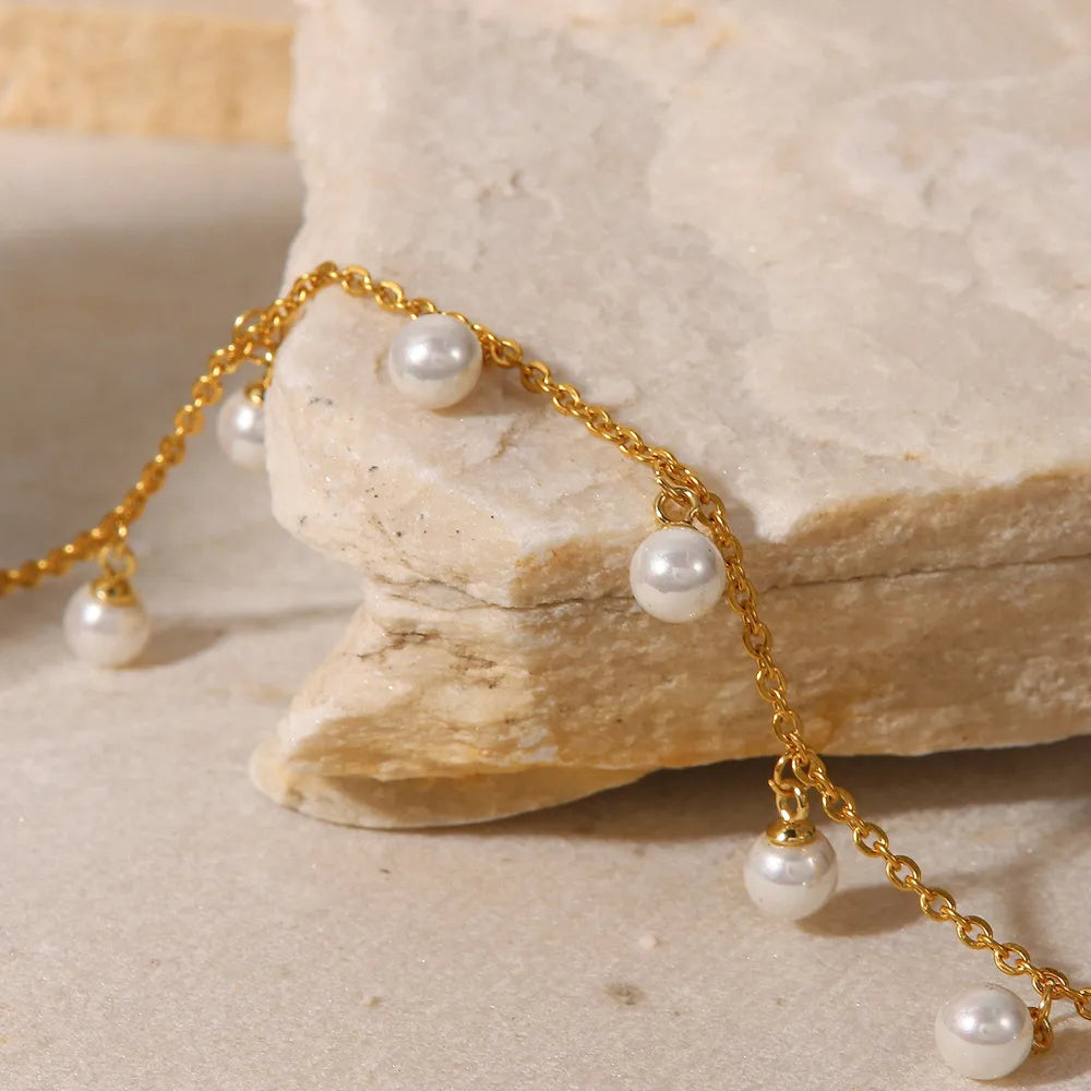 Macro close-up of the Lumina anklet showing the intricate gold-plated stainless steel chain and secure pearl charms - tarnish resistant details by Varex HQ