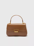 Mini brown vegan leather crossbody bag - front view showing turn-lock clasp
