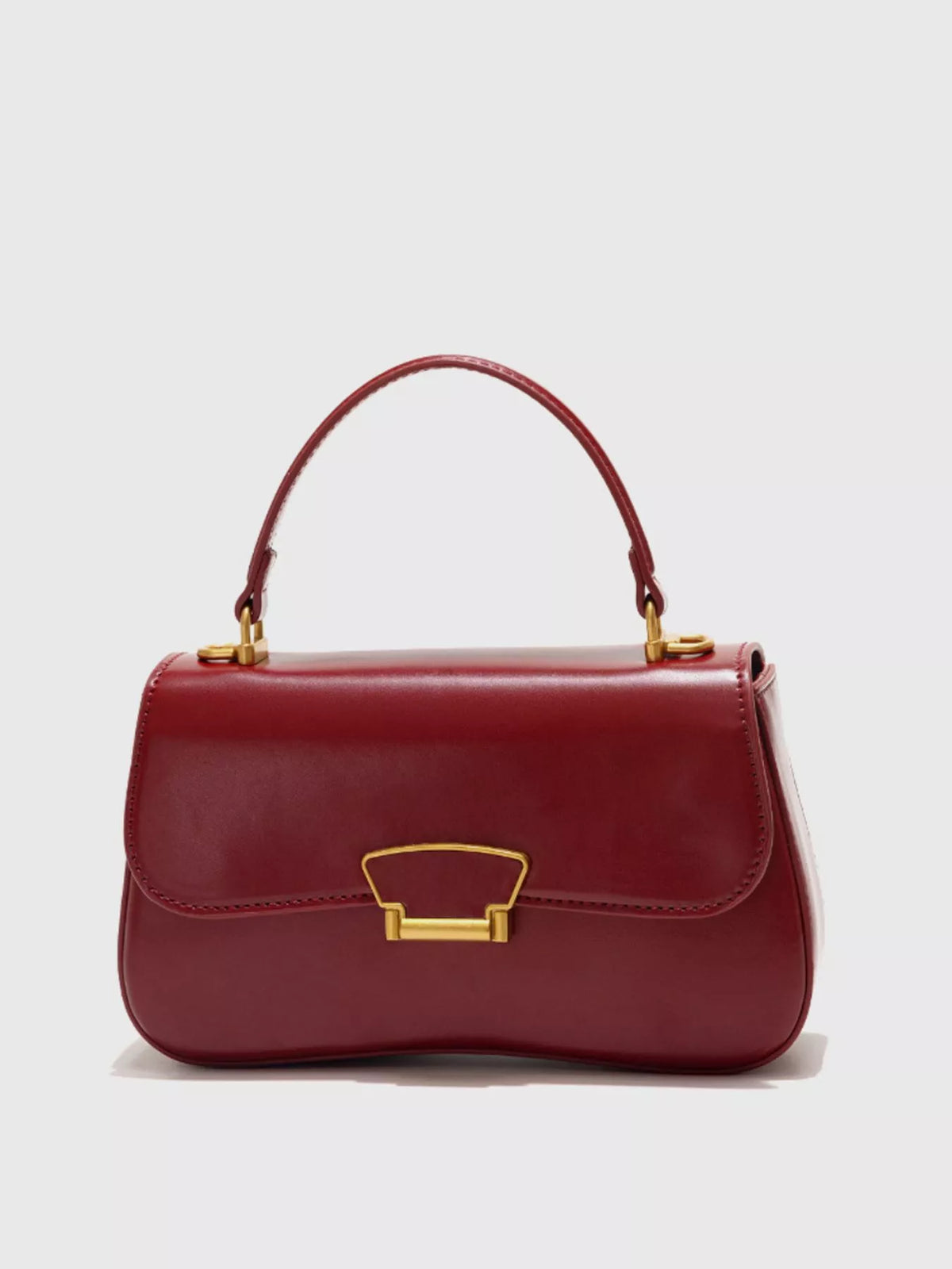 Mini vegan leather crossbody bag - side angle showing structured silhouette