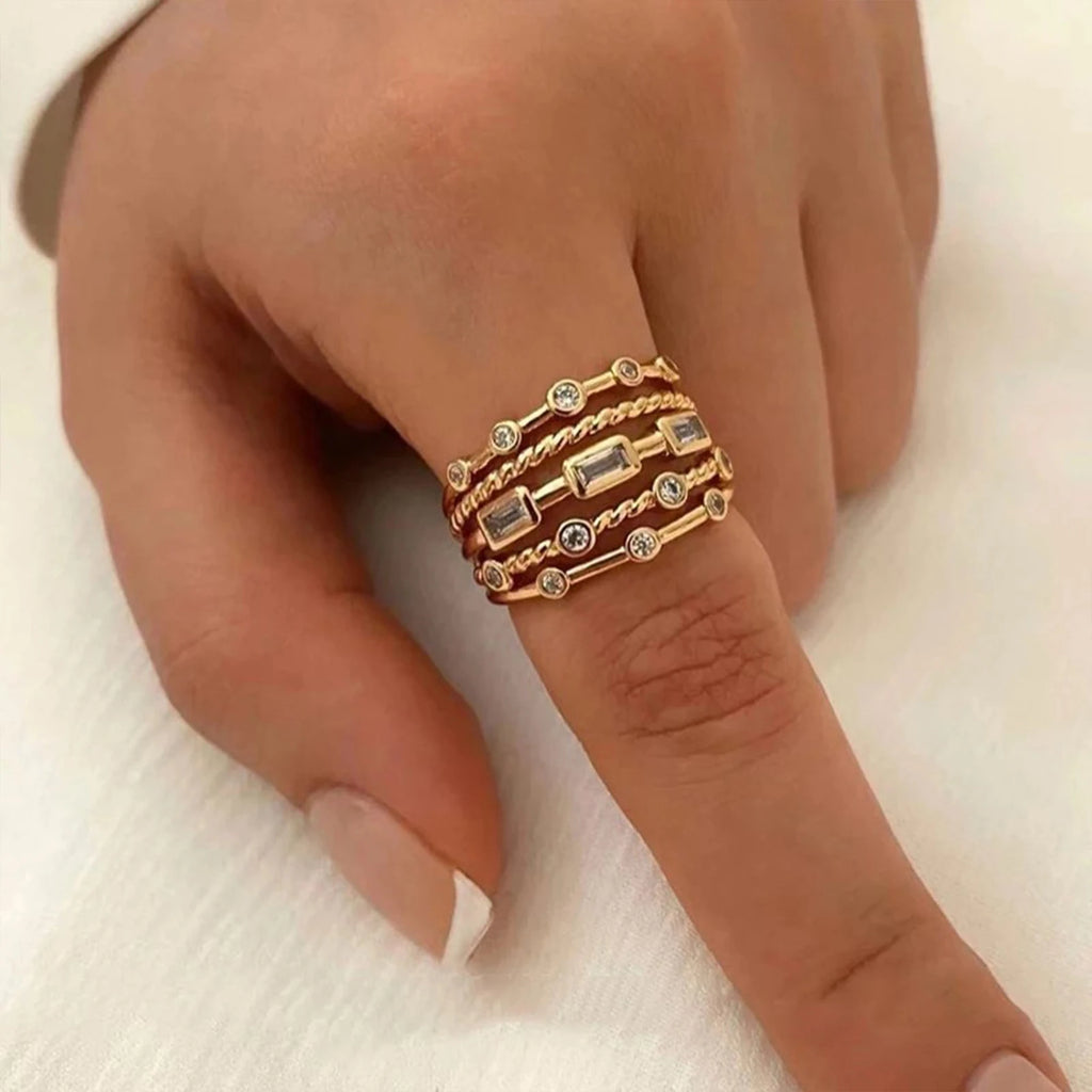 Baguette-cut cubic zirconia row close-up on gold-tone ring