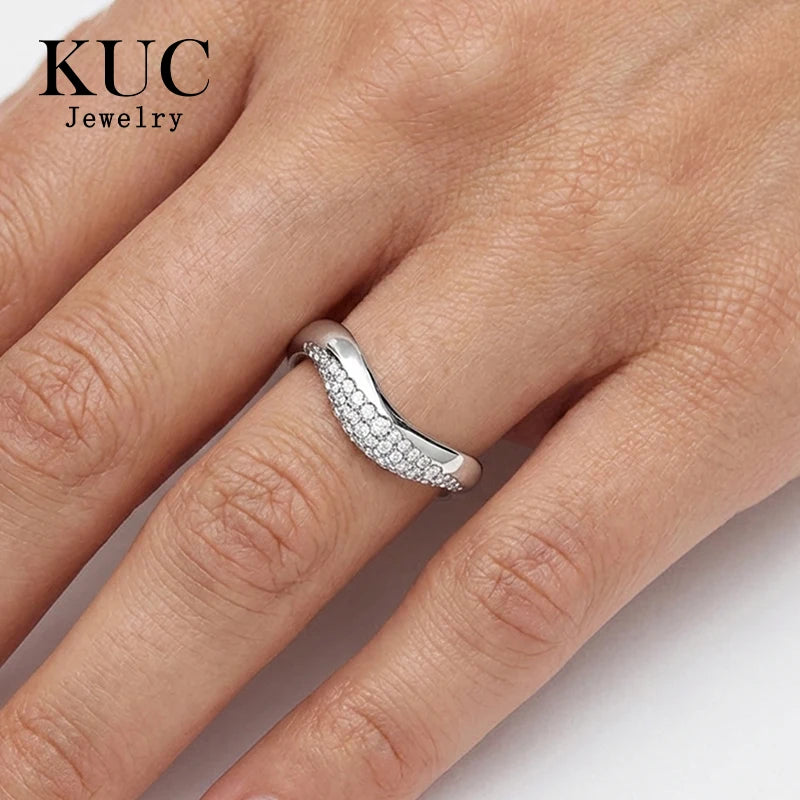 Pave wave dome ring worn on finger