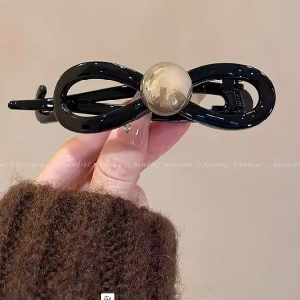 Pearl Mini Hair Claw Clip in acrylic with faux pearl accents, lifestyle shot - Varex HQ