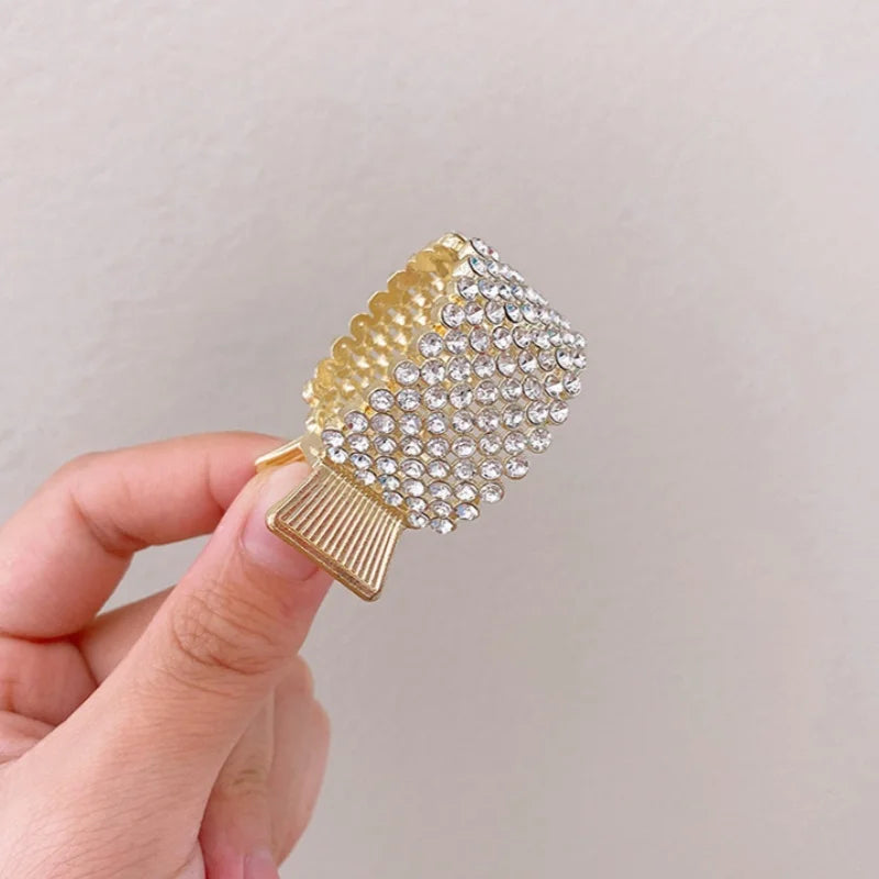 Pearl Rhinestone Hair Claw Clip in gold and silver-tone rhinestone finish, in hand for scale - Varex HQ