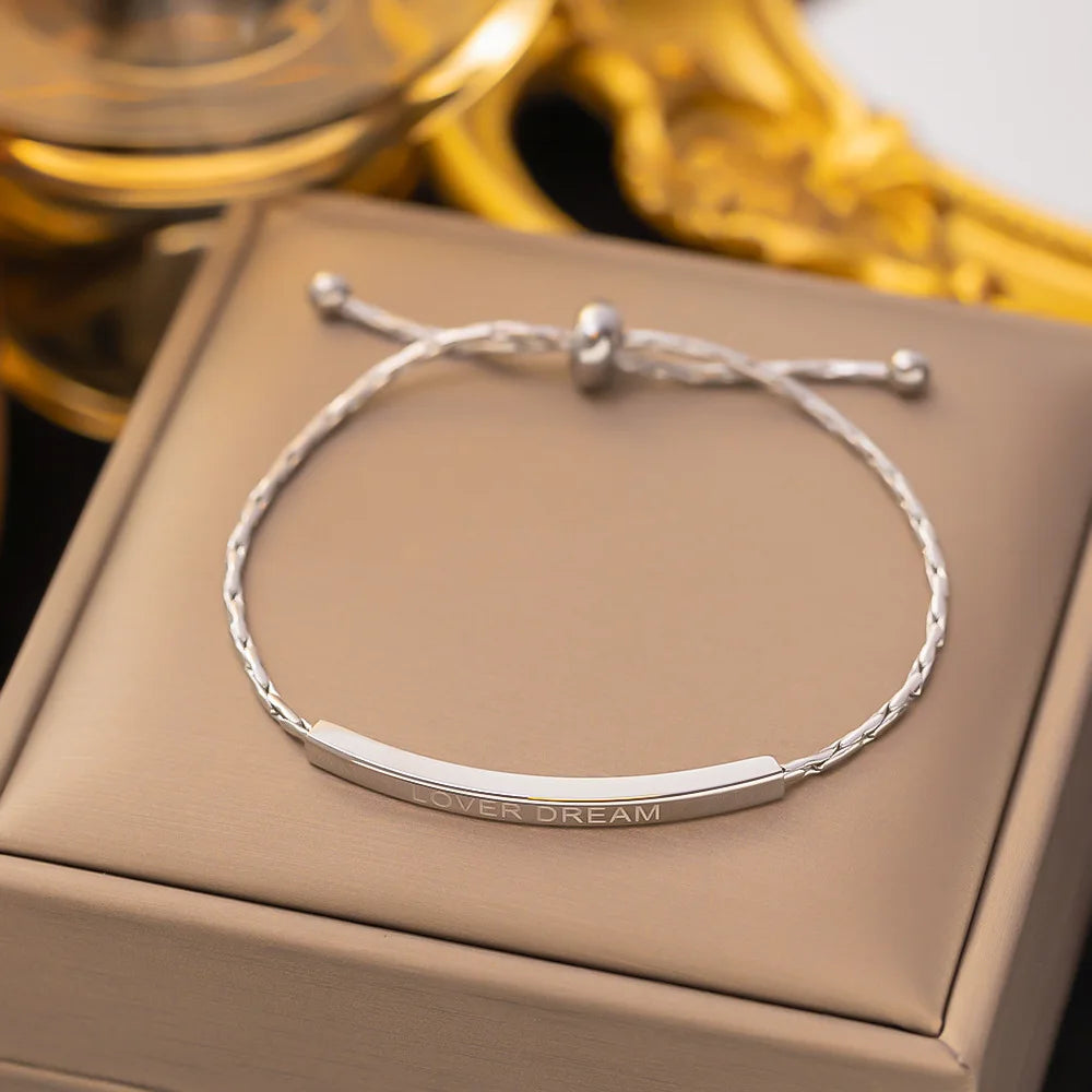 Silver-tone stainless steel pull-back bangle detail - Varex HQ
