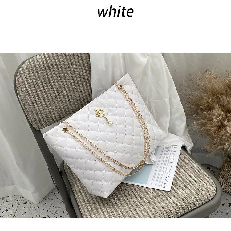 Pink quilted vegan leather shopper tote - lifestyle shot worn on the shoulder
