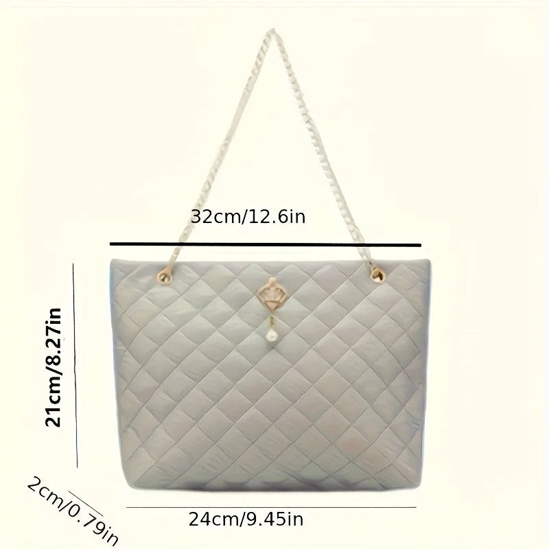 Pink quilted vegan leather shopper tote - close-up of chain-detail strap and pendant charm