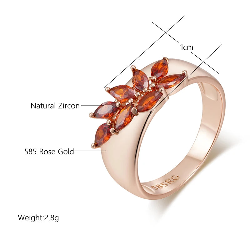 Top view of leaf motif ring with red zircon accent