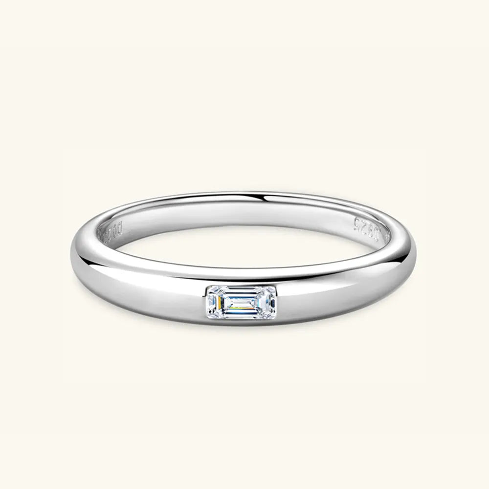 Front view of 925 sterling silver ring with flush-set moissanite stone.