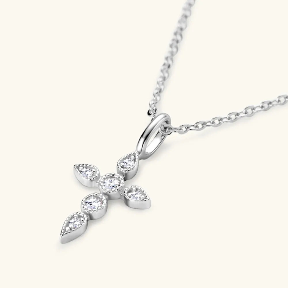 Close-up of 925 sterling silver moissanite cross pendant detailing.