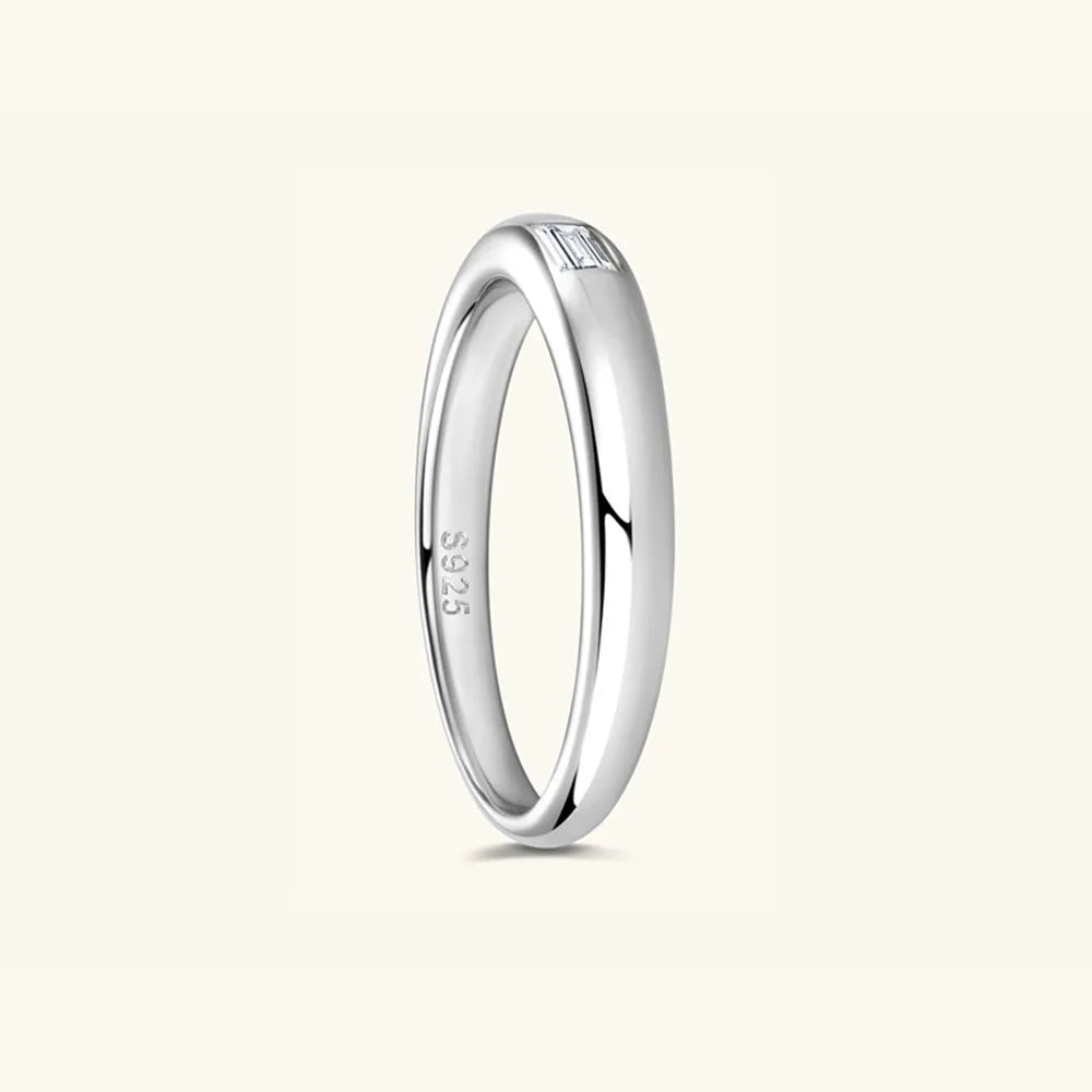 Angled view of polished silver sterling 925 moissanite band ring.