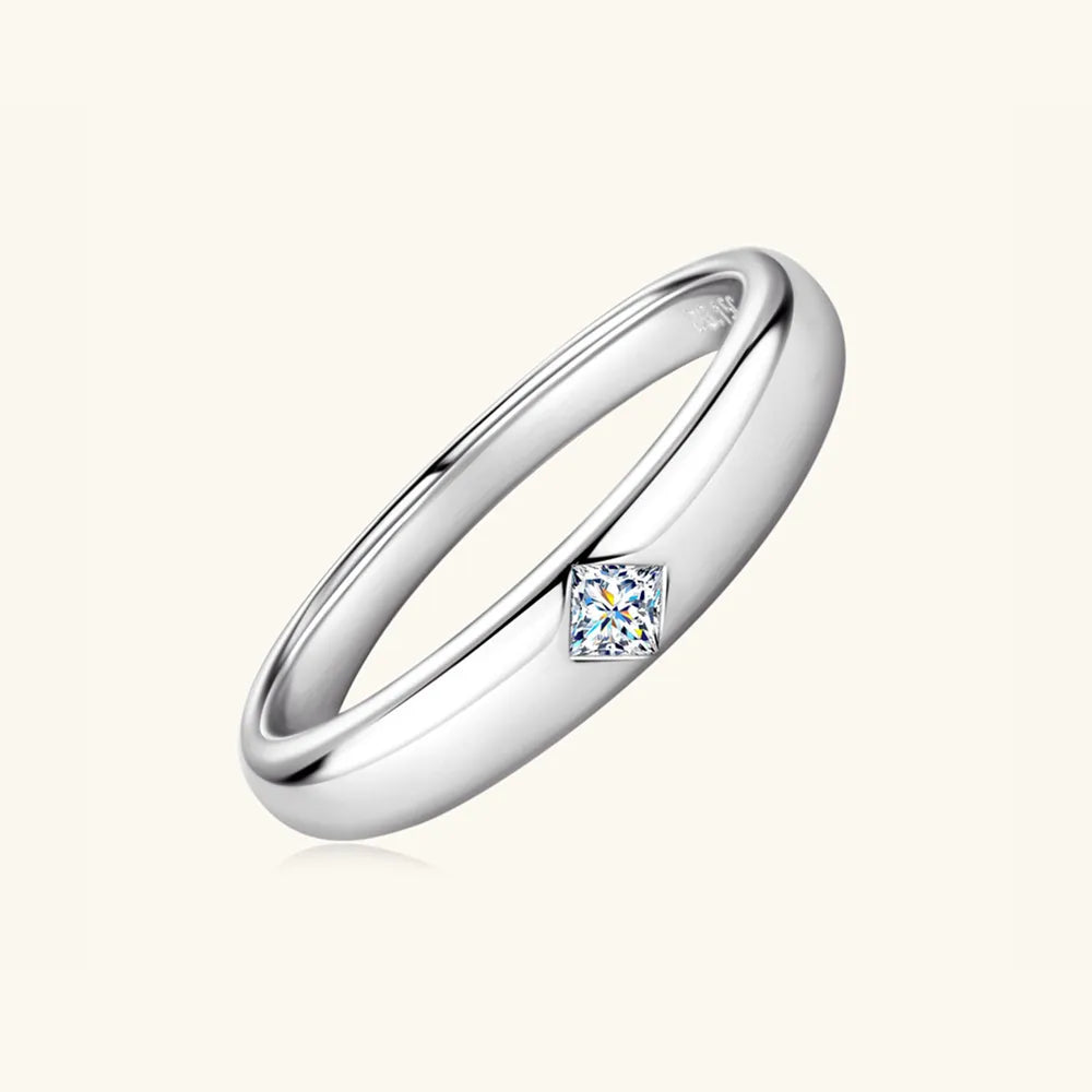 Side-angle shot of polished 925 sterling silver moissanite ring.