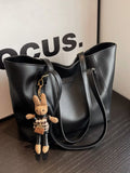 Slouchy black vegan leather tote bag - front view showing relaxed silhouette
