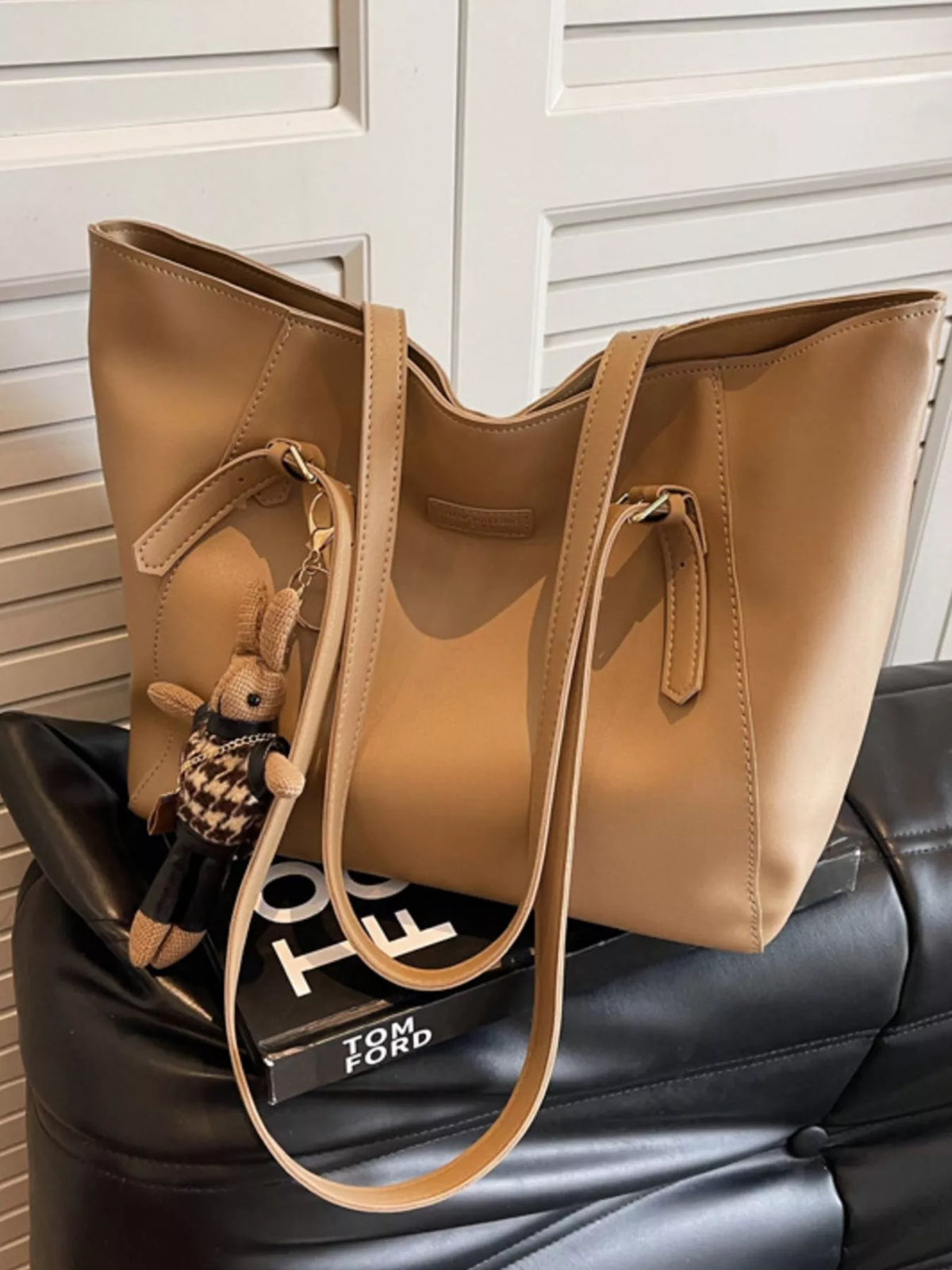 Slouchy vegan leather tote bag - side angle showing soft-touch leather texture