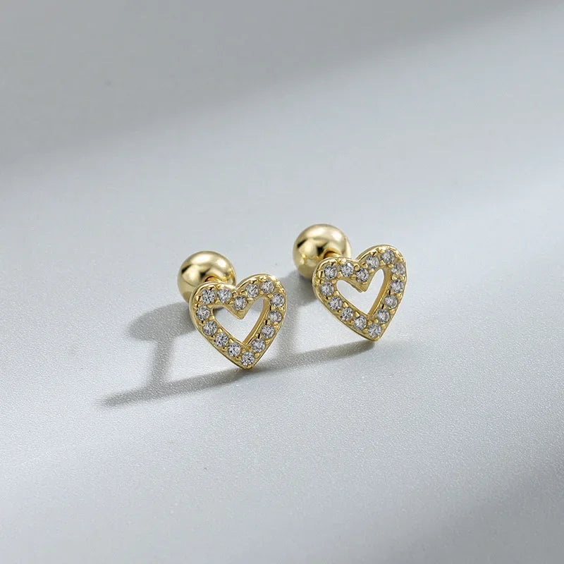 Sparkle heart screw-back cartilage stud earrings styled on model, lifestyle shot - Varex HQ