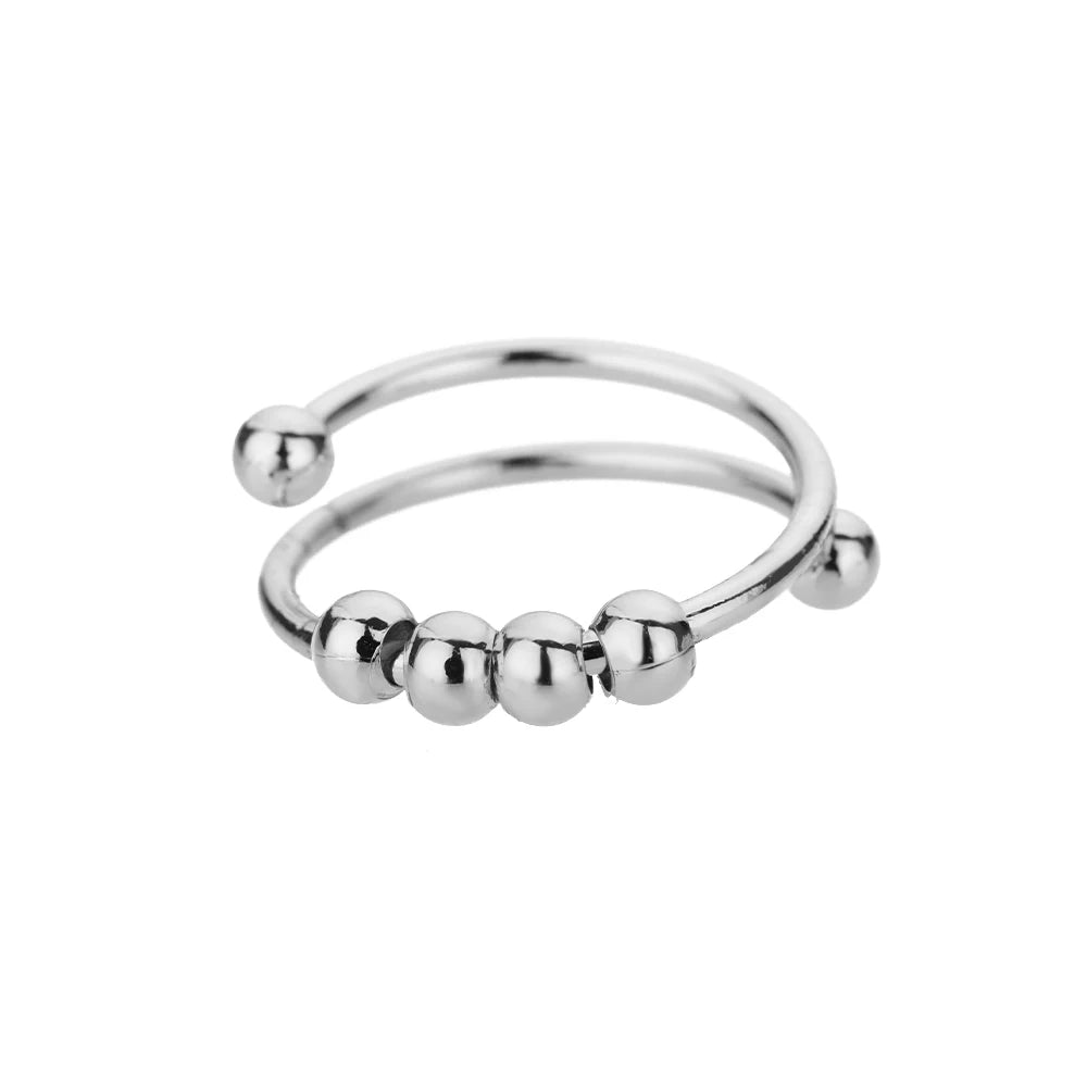 Close-up texture detail of stainless steel spinner ring band