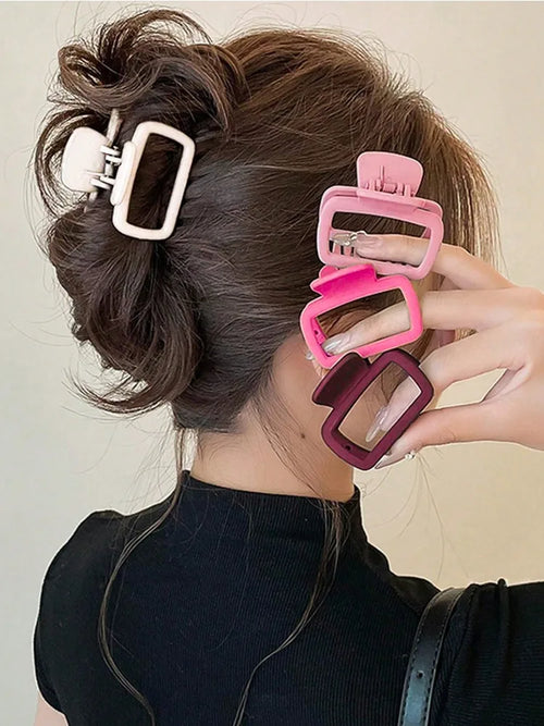 4-Piece Square Hair Claw Clip Set in acrylic, assorted colours, worn in hair - Varex HQ