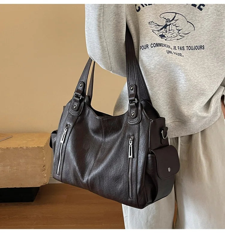 Vertical-Zip Vegan Leather Multi-Compartment Tote in coffee brown, studio product shot showing structured silhouette and buckle strap detail – Varex HQ
