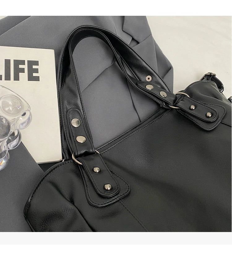 Vertical-Zip Vegan Leather Multi-Compartment Tote in black, close-up of handle straps and buckle hardware – Varex HQ