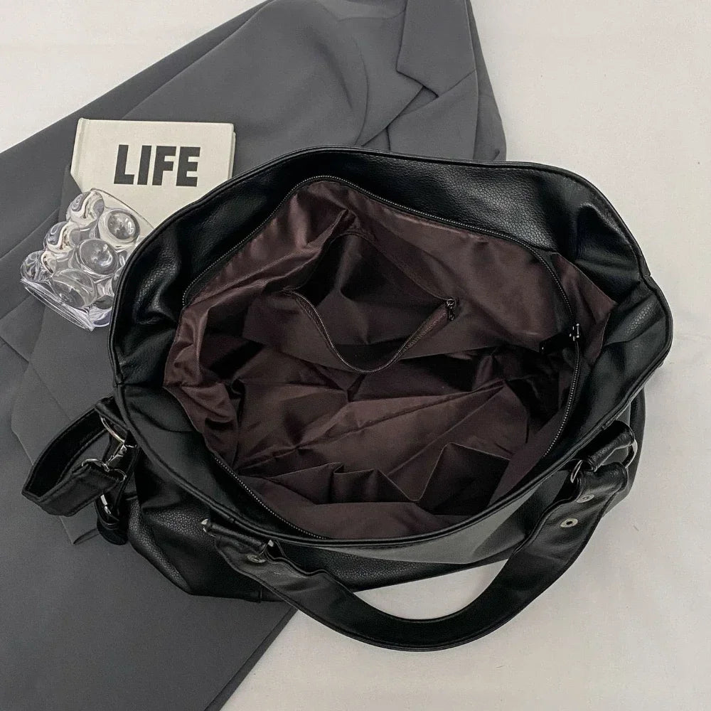 Vertical-Zip Vegan Leather Multi-Compartment Tote in black, open interior view showing lining and zip pocket organisation – Varex HQ
