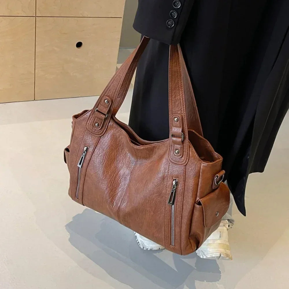 Vertical-Zip Vegan Leather Multi-Compartment Tote in brown, side view showing zip pocket detail and structured handles – Varex HQ