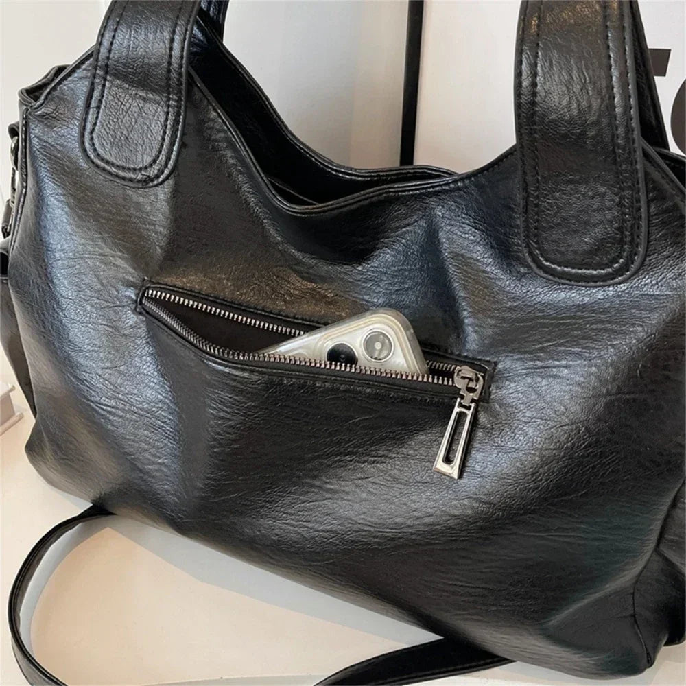 Vertical-Zip Vegan Leather Multi-Compartment Tote in black, close-up of front zip pocket and vegan leather texture – Varex HQ