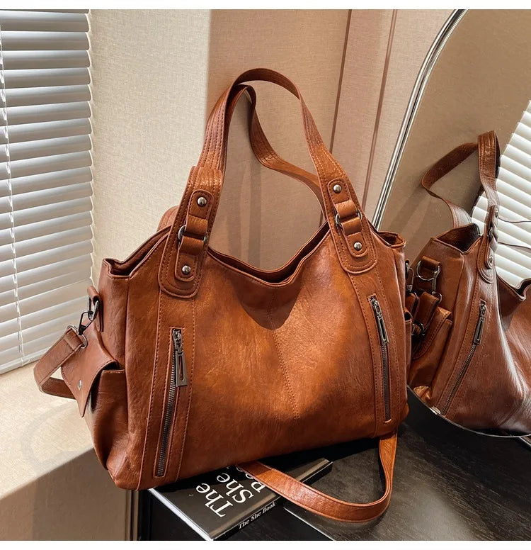 Vertical-Zip Vegan Leather Multi-Compartment Tote in tan brown, angled view showing structured silhouette and zip pocket – Varex HQ